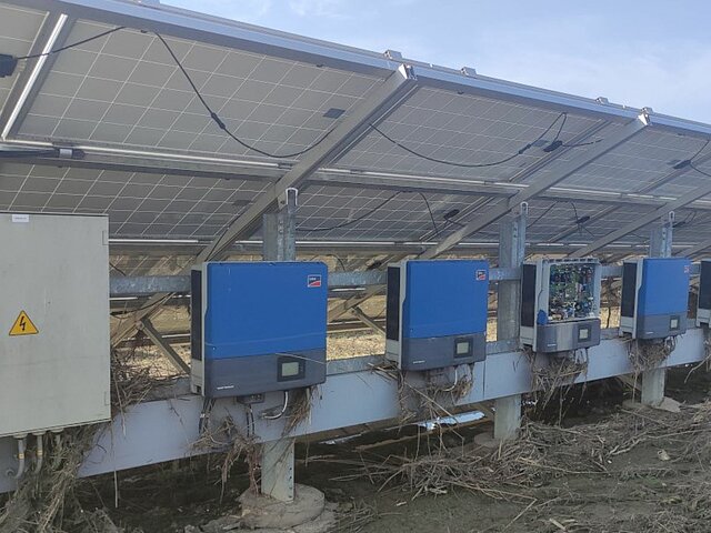 Solar plant with debris from flooding.