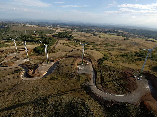 Visible is the Guanacaste wind farm in Central America. The many wind turbines stretch to the horizon.